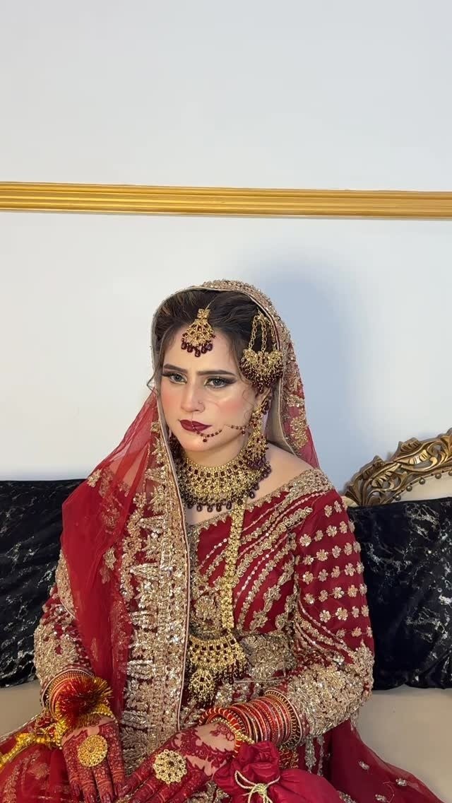Red bridal makeup with traditional jewellery