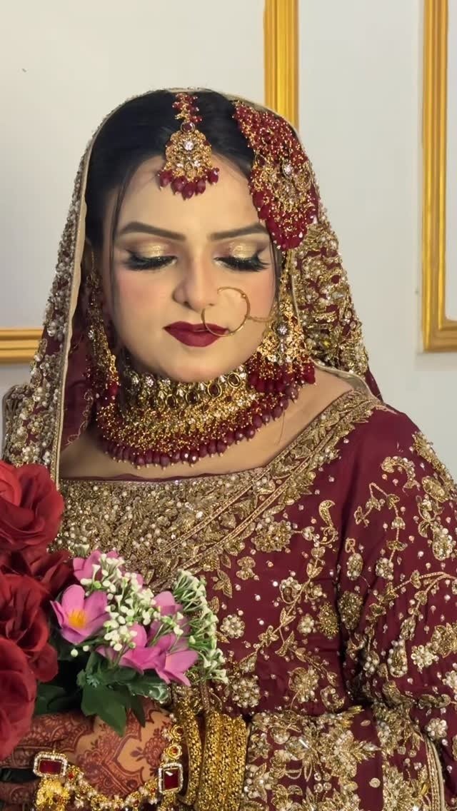 Maroon bridal makeup with floral bouquet