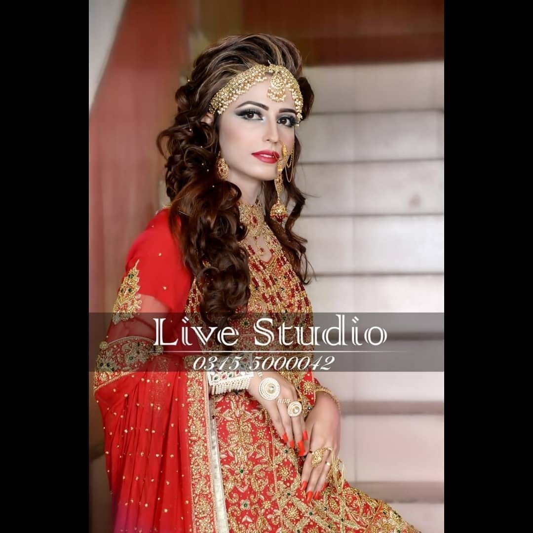 Classic red bridal makeup and long curls
